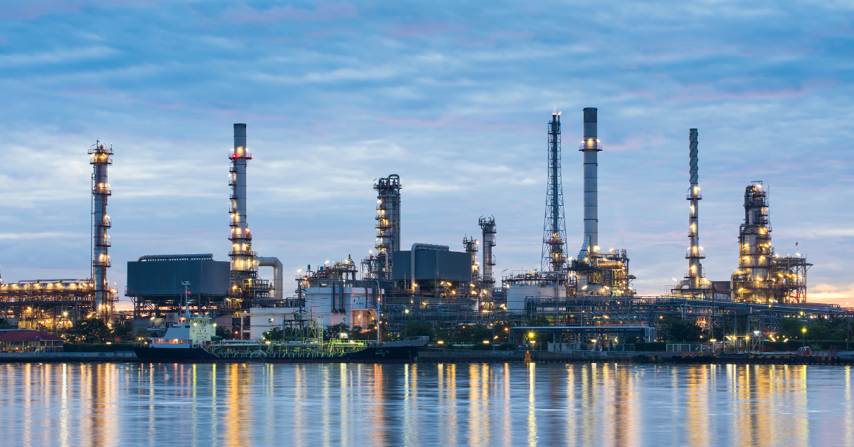 a large factory with lights on it